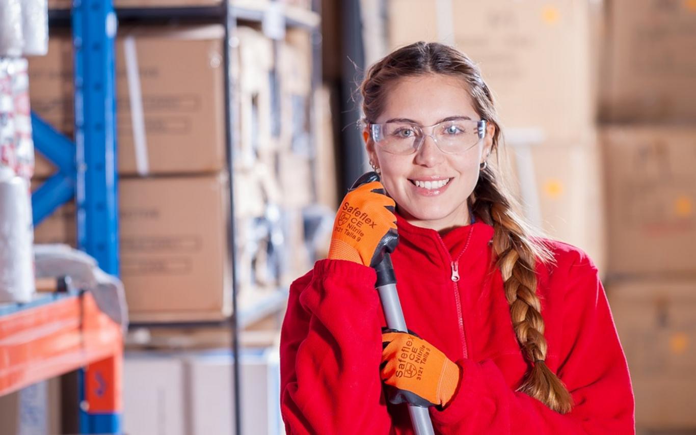 Custodial student cleaning a warehouse